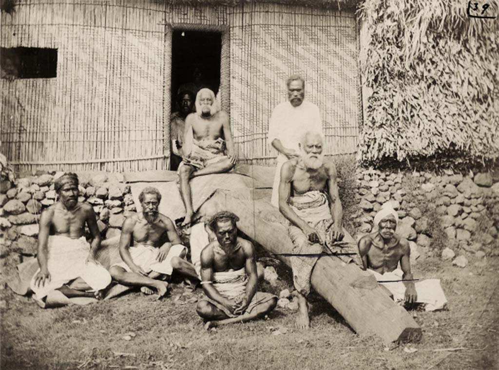 “Great Council of Chiefs, Waikava”. Senior members of the Great Council of Chiefs with Cakobau seated at the top of the ramp above his brother Ratu Josefa Celua. The chief to his left, wearing a white masi turban is likely Musudroka, the Vunivalu of Rewa. Waikava, Vanua Levu, Fiji. Possibly photographed by F. Dufty, December 1876. P.99842.VH Source: http://maa.cam.ac.uk/photo-great-council-of-chiefs-p-99842-vh/